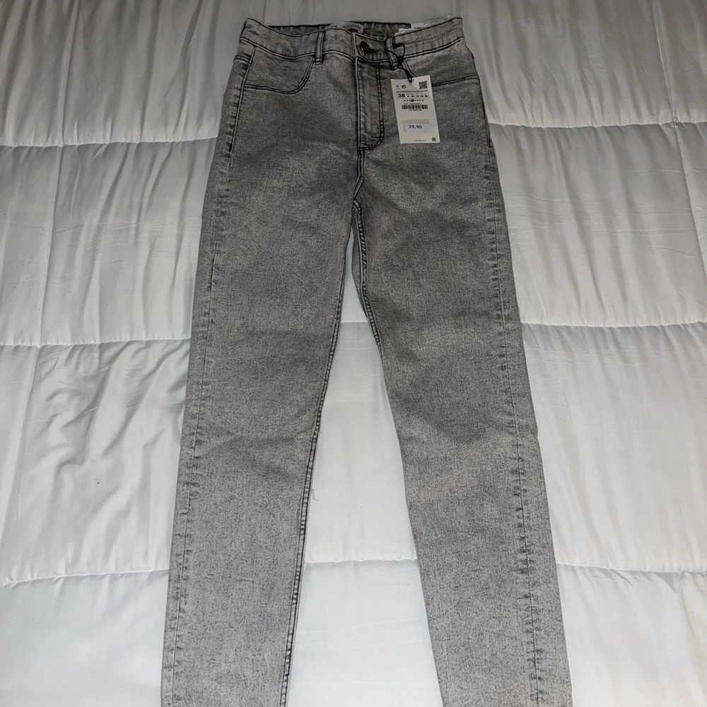 Acid wash grey skinny jeans from Zara.